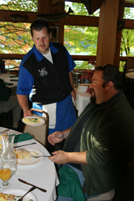 Chef Royal serving a meal to Christopher Lower